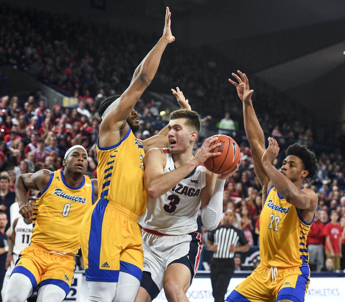 Gonzaga forward Filip Petrusev is fouled by CSU Bakersfield forward Darrin PersonJr., Saturday, Nov. 23, 2019, at the McCarthey Athletic Center. (Dan Pelle / The Spokesman-Review)