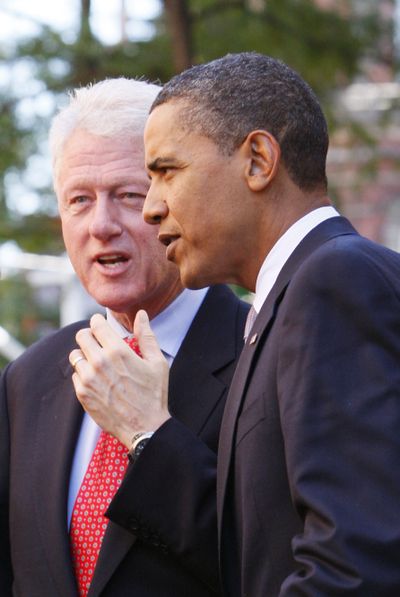 President Barack Obama talks with former President Bill Clinton outside a restaurant in Greenwich Village in New York on Monday after Obama spoke about the financial crisis, on the anniversary of the Lehman Brothers collapse, at Federal Hall on Wall Street.  (Associated Press / The Spokesman-Review)