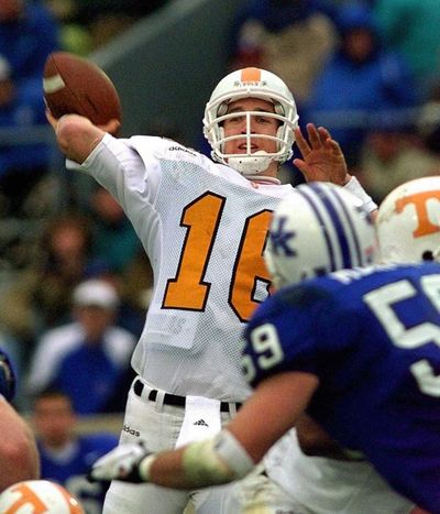 In this Nov. 22, 1997, photo, Peyton Manning launches a pass during the second half of his Tennessee’s 59-31 win over Kentucky in an NCAA college football game in Lexington, Ky. Manning and his Southeastern Conference nemesis, former Florida coach Steve Spurrier, will go into the College Football Hall of Fame together. (Ed Reinke / Associated Press)