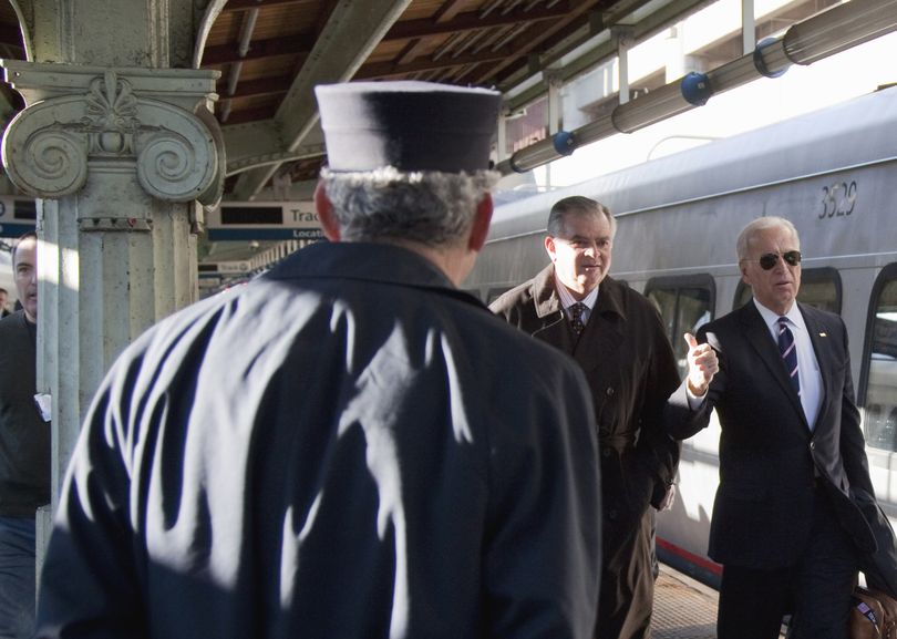 Vice President Joe Biden, right, and Transportation Secretary Ray LaHood walk to a train in Washington, D.C., on Tuesday, heading to Philadelphia. (Associated Press)