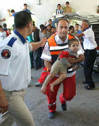 
A Palestinian medic rushes a child who was wounded during clashes between militants and Israeli forces in the Zeitoun neighborhood into Shifa Hospital in Gaza City on Wednesday .A Palestinian medic rushes a child who was wounded during clashes between militants and Israeli forces in the Zeitoun neighborhood into Shifa Hospital in Gaza City on Wednesday .
 (Associated PressAssociated Press / The Spokesman-Review)