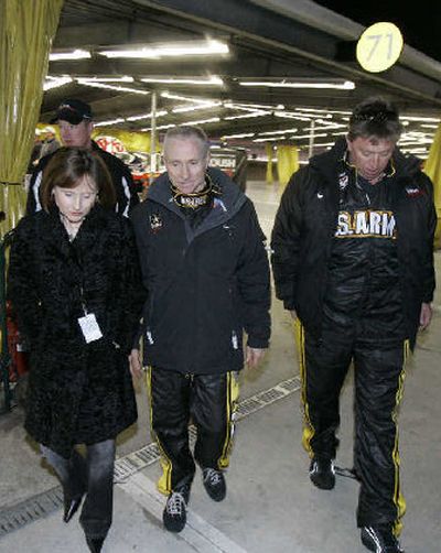 
Mark Martin, center, walks with his wife, Arlene, following Martin's second-place finish. 
 (Associated Press / The Spokesman-Review)