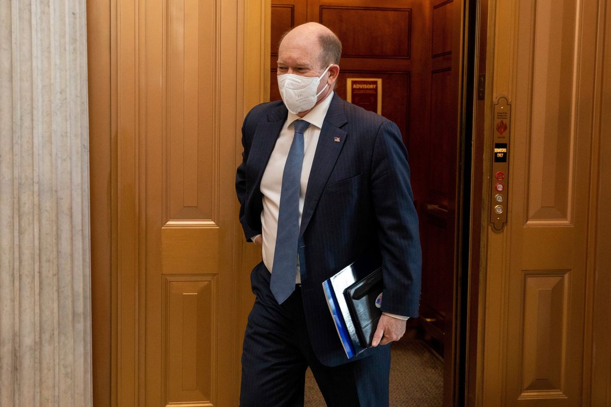 Sen. Chris Coons, D-Del., walks towards the floor of the senate at the Capitol in Washington, Wednesday, Jan. 19, 2022.  (Amanda Andrade-Rhoades)