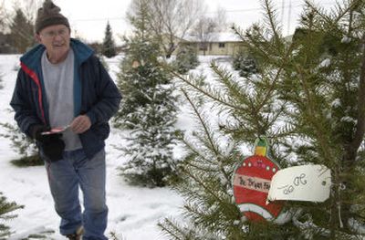 
For years, Bill Clutter sold short Christmas trees. But now, since his trees have grown to a perfect size, many of his loyal customers come to his Otis Orchards farm and mark their tree and return later to cut them. 
 (J. BART RAYNIAK PHOTOS / The Spokesman-Review)