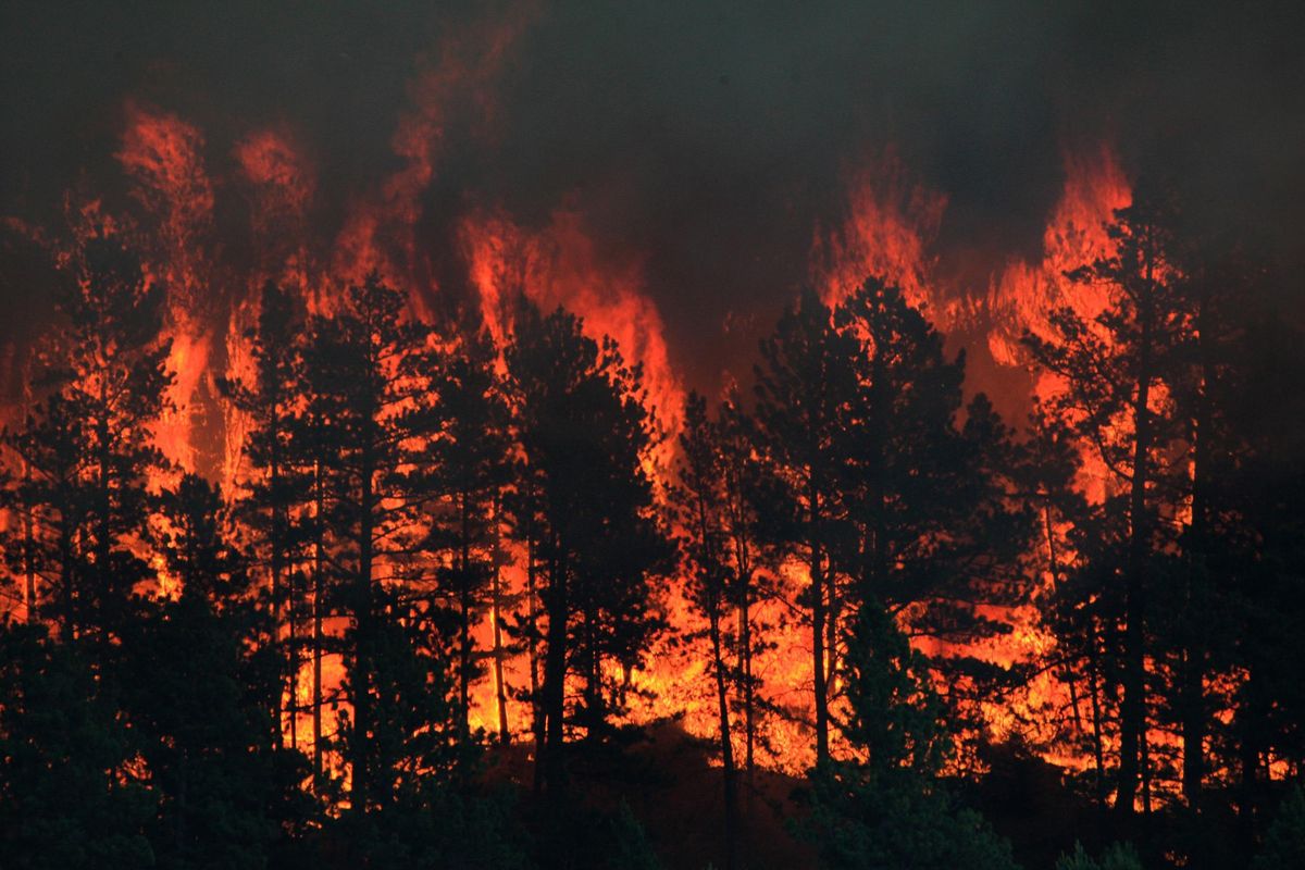 In this Thursday, July 6, 2017 photo, a wildfire burns near the historic mining town of Landusky, south of the Fort Belknap Indian Reservation in north-central Montana. Officials ordered about 30 residents to evacuate after winds shifted and the wildfire moved to within a mile of the historic mining town (Meg Oliphant / ap)