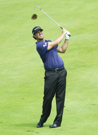 Scott Piercy watches his shot to the green on 17 during second- round play at the 2012 Canadian Open. (Associated Press)