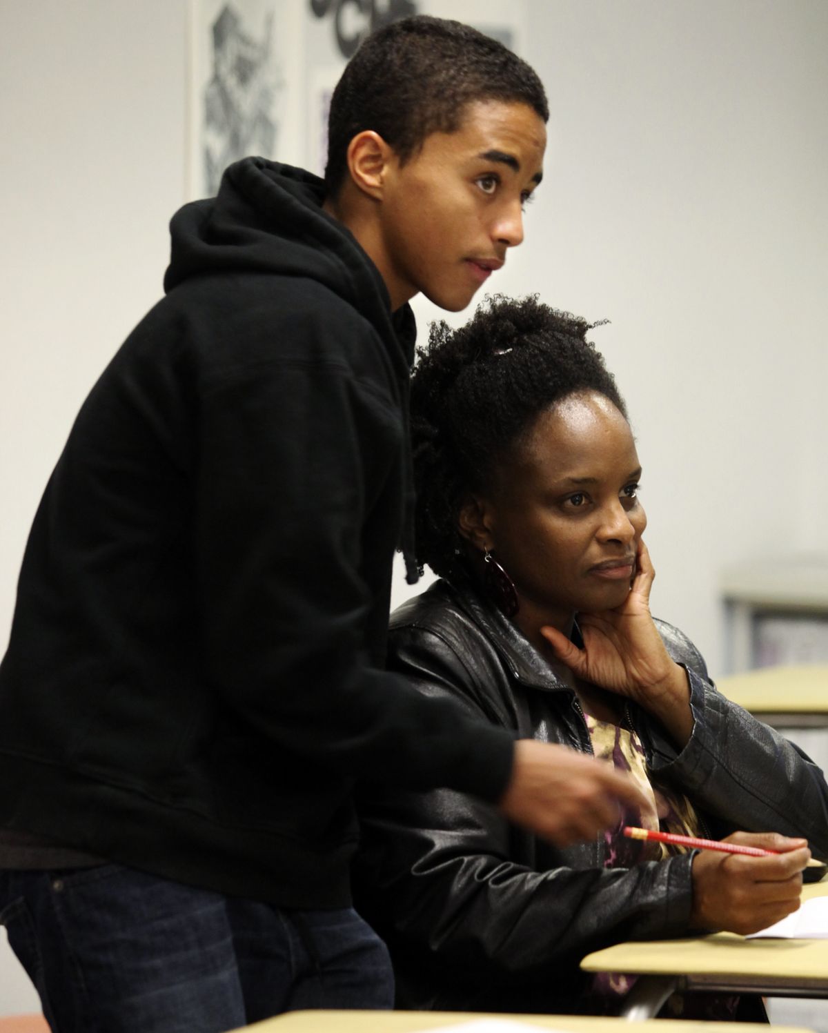Jacobie Gerchak helps his mother Joy last week. (Associated Press)
