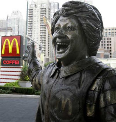 
A statue of Ronald McDonald points toward an electronic billboard advertising McDonald's premium roast coffee outside the Rock and Roll McDonald's in Chicago. Associated Press
 (Associated Press / The Spokesman-Review)