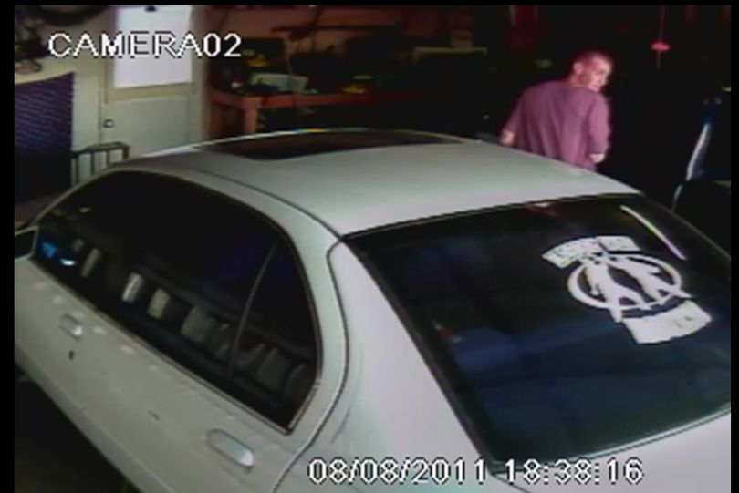 Police are asking for help identifying a thief who stole an MP3 player from an SUV inside a Spokane Valley garage this month.
The victim's security video system captured images of the thief, who appears to be a white man about 25 to 35 years old with crew-length brown hair, thin and wearing a reddish t-shirt, shorts and dark shoes. 
The burglary occurred Aug. 9 about 6:30 p.m in the 11400 block of East Railroad Avenue. Anyone with information on the thief is asked to call Crime Check at (509) 456-2233.
    (Spokane Valley Police Department)