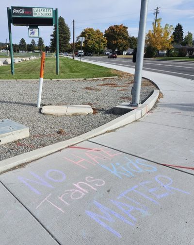 Messages of support for transgender students written in chalk on Friday outside East Valley High School.  (Amanda Sullender / The Spokesman-Review)