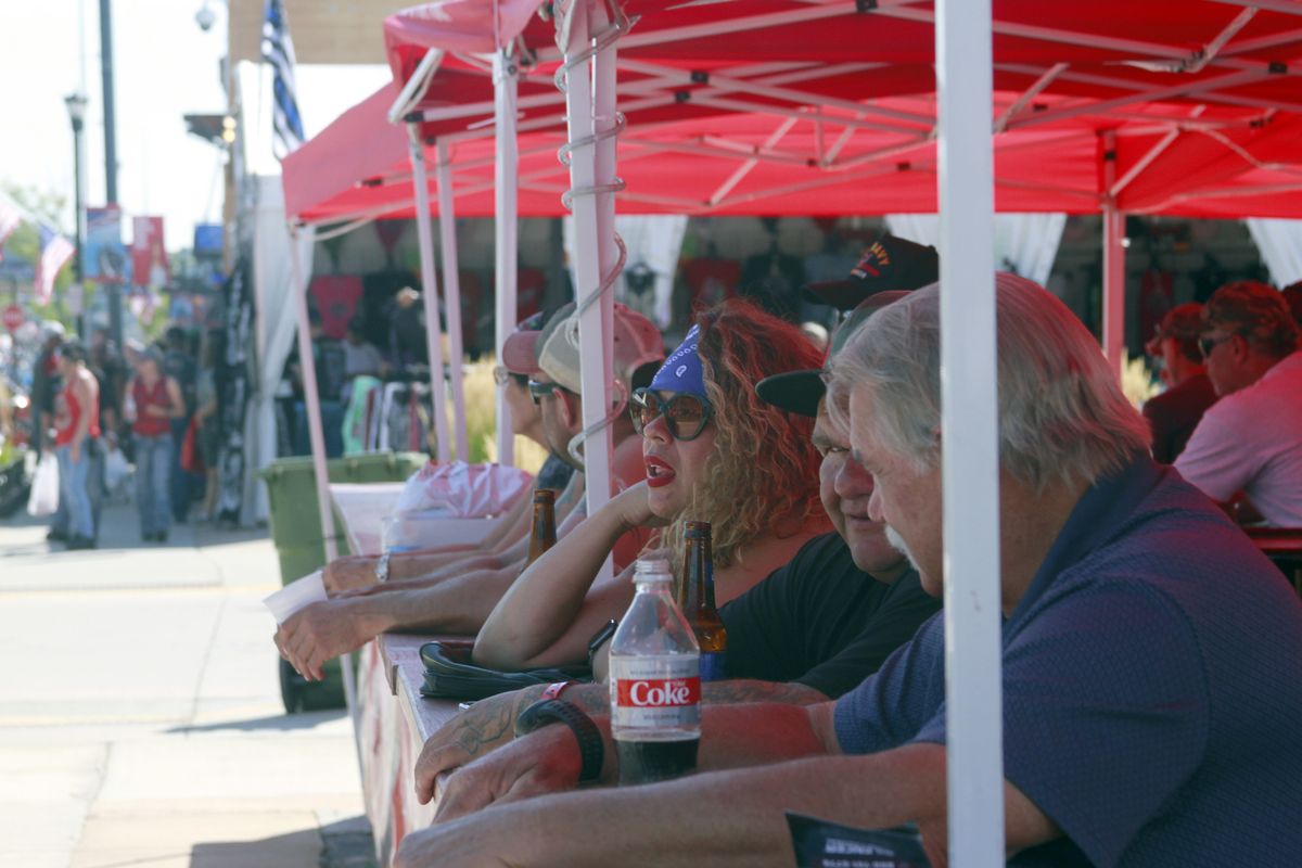 Thousands of bikers rode through the streets for the opening day of the 80th annual Sturgis Motorcycle rally Friday, Aug. 7, 2020, in Sturgis, S.D. Many at the rally defied coronavirus precautions like wearing face masks or social distancing.  (Stephen Groves)