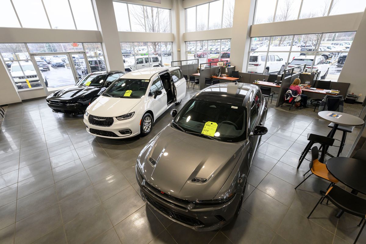 Cars sit in the showroom at the Golling Chrysler Dodge Jeep Ram dealership in Bloomfield Hills, April 10, 2025.   (David Guralnick, Detroit News/The Detroit News/TNS)