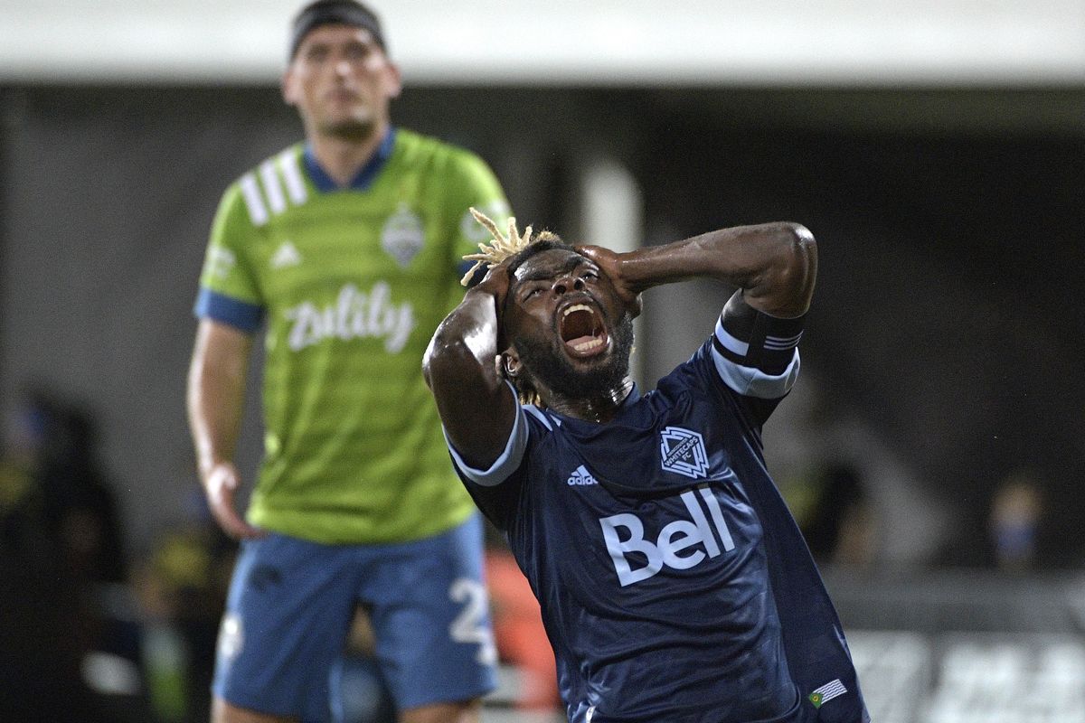 Vancouver Whitecaps midfielder Leonard Owusu reacts after missing a shot on goal as Seattle Sounders defender Shane O