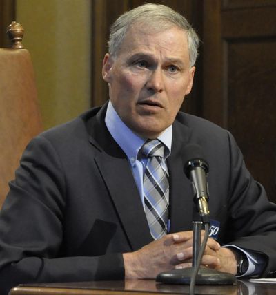 Gov. Jay Inslee speaks with reporters Monday after signing the state’s supplemental operating and capital budgets. (Jim Camden / The Spokesman-Review)