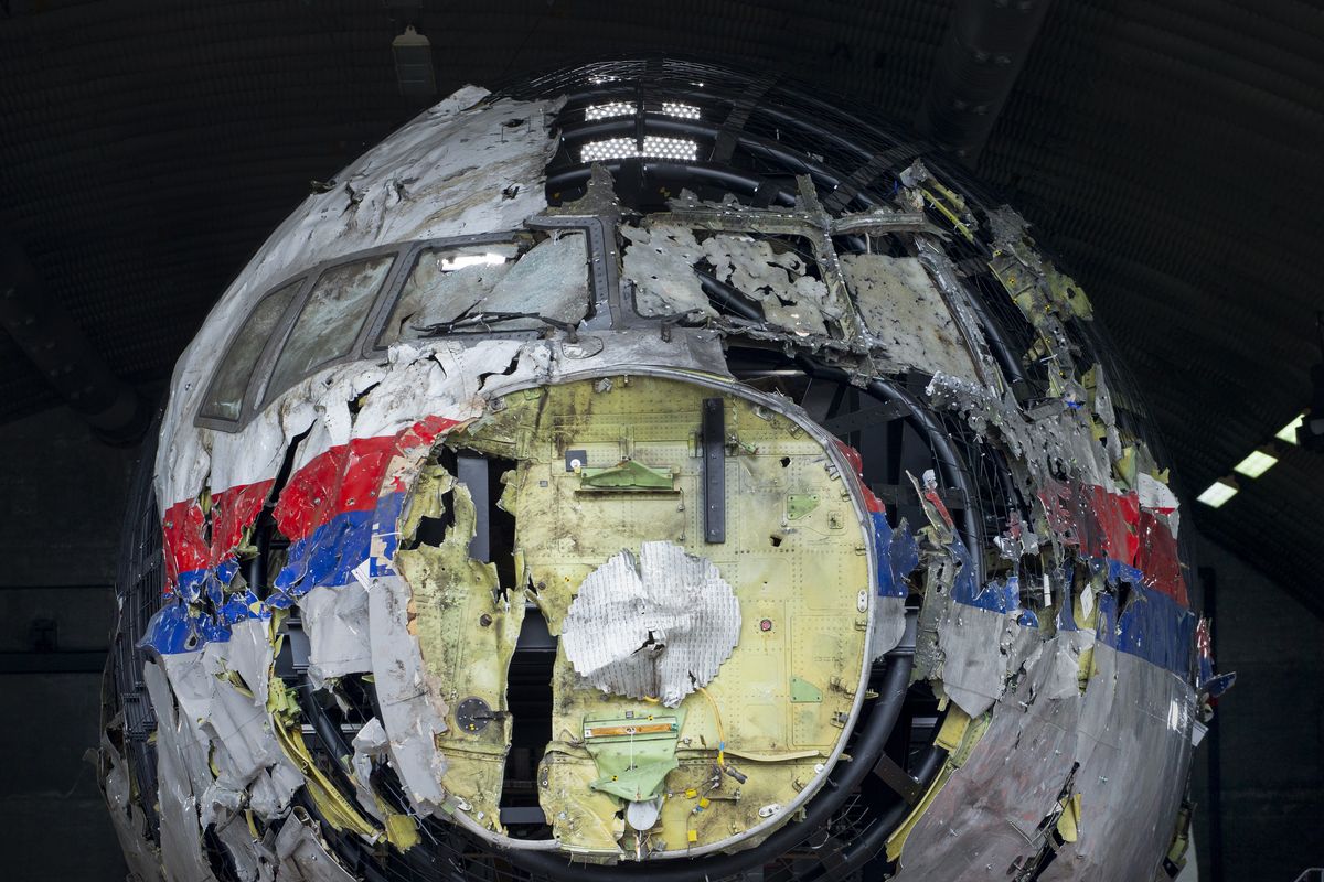 FILE- In this Wednesday, May 26, 2021, file photo the reconstructed wreckage of Malaysia Airlines Flight MH17, is shown at the Gilze-Rijen Airbase, southern Netherlands. The trial in absentia in a Dutch courtroom of three Russians and a Ukrainian charged in the downing of Malaysia Airlines flight MH17 in 2014 moves to the merits phase, when judges and lawyers begin assessing evidence.  (Peter Dejong)
