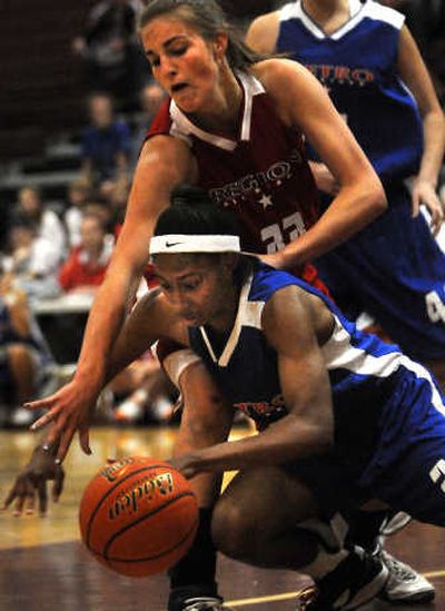 
Region's Katie Baker, top, battles for the ball. 
 (Rajah Bose / The Spokesman-Review)