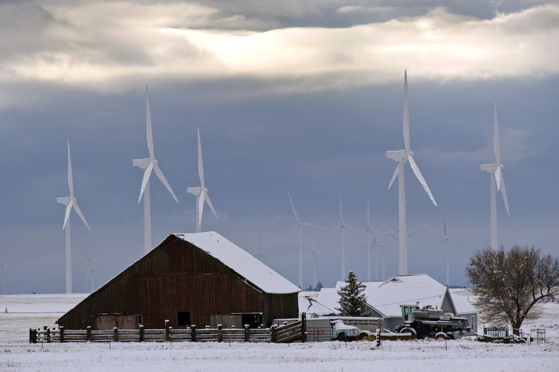 On the outskirts of Bickleton, Wash., windmills have been sprouting up on farms. The green energy source has been a boon to the small town, which is using some of the increased property tax revenue to fund a new $10.4 million K-12 school. (Colin Mulvany / The Spokesman-Review)
