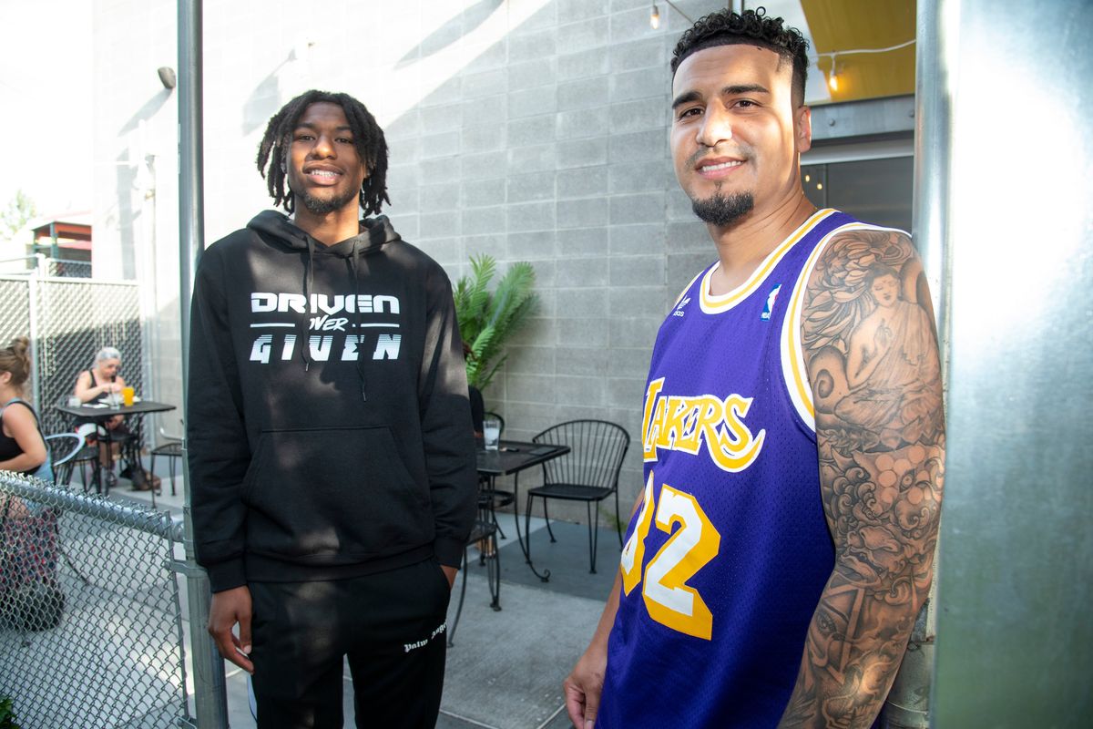 Gonzaga basketball player Dominick Harris, left, meets with Jordan Smith on June 29 at Cascadia Public House. The north Spokane restaurant, owned by Smith, has struck a name, image and likeness deal with Harris.  (Jesse Tinsley/The Spokesman-Review)