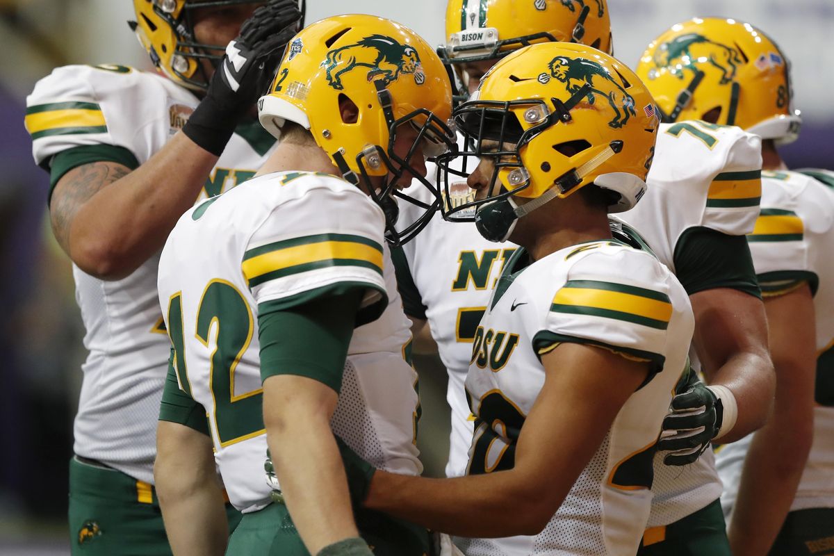 North Dakota State wide receiver Darrius Shepherd, right, celebrates with quarterback Easton Stick, left, after catching a 20-yard touchdown pass during the first half  against Northern Iowa on Oct. 6 in Cedar Falls, Iowa. (Charlie Neibergall / AP)