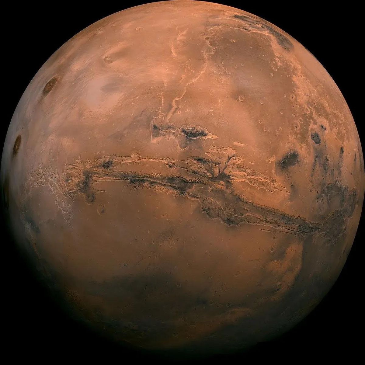Mosaic of the Valles Marineris hemisphere of Mars projected into point perspective, a view similar to that which one would see from a spacecraft.  (Provided by NASA)