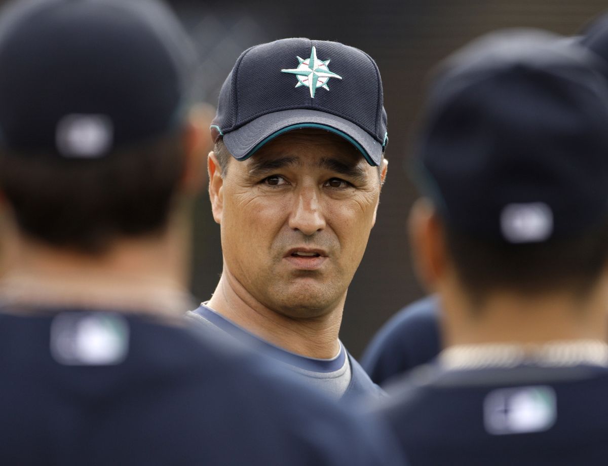 Seattle Mariners manager Don Wakamatsu talks to some of his players during spring training Monday in Peoria, Ariz.  (Associated Press / The Spokesman-Review)