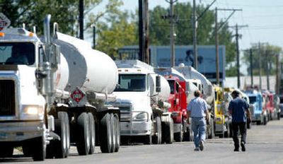 
Tankers line up in Grand Forks, N.D., to buy wholesale fuel in expectation of higher prices. 
 (Associated Press / The Spokesman-Review)