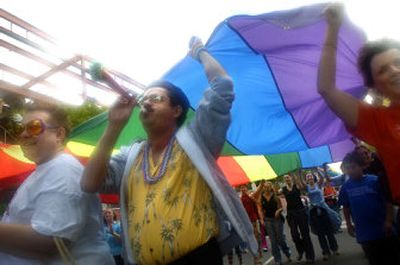 
Members of the Unitarian Universalist Church of Spokane march in the OutSpokane Pride Parade on Riverside Avenue Saturday afternoon. The parade is a celebration of the area's gay, lesbian, bisexual and transgendered community. 
 (Holly Pickett / The Spokesman-Review)