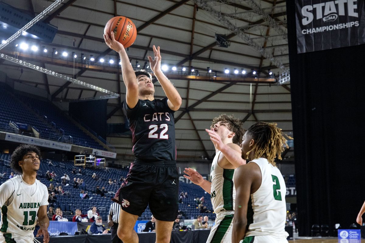 Mt. Spokane’s Nalu Vargas, middle, puts up a shot in front of three Auburn defenders during action in the 3A Boys State Basketball Tournament on Saturday, March 4, 2023, in Tacoma, Wash. Mt. Spokane outscored Auburn 21-3 in the 4th quarter for the come-from-behind 60-51win to take 3rd place.  (Patrick Hagerty)