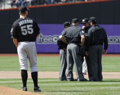 Umpires gather in New York to determine if Fernando Tatis’ home run for the Mets should stand.  (Associated Press / The Spokesman-Review)