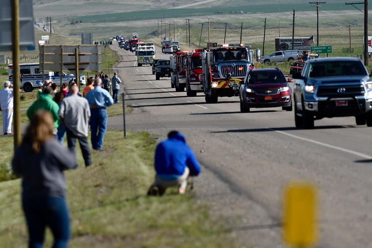 People line Highway 287 as the procession for slain Broadwater County Deputy Mason Moore travels to the memorial service in Belgrade, Mont. (Thom Bridge / Independent Record)