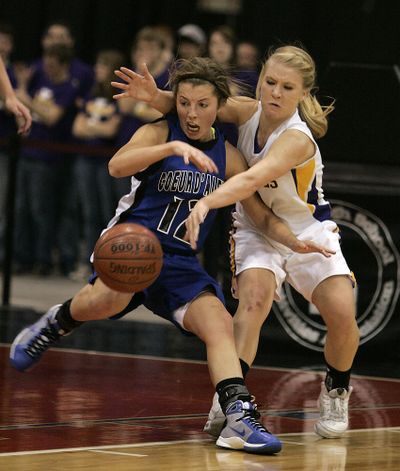 Lewiston's Karlee Wilson (2) strips the ball away from Coeur d' Alene's Kyeli Parker (12) during the first half in the 5A Girls State Championship high school basketball game on Saturday, Feb. 19, 2011, in Nampa, Idaho. (Matt Cilley / Fr117486 Ap)
