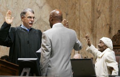 
 State Supreme Court Judge Charles Johnson swears in Speaker Pro Tempore John Lovick as his 95-year-old grandmother, Elise Lovick, joins in. 
 (Associated Press / The Spokesman-Review)