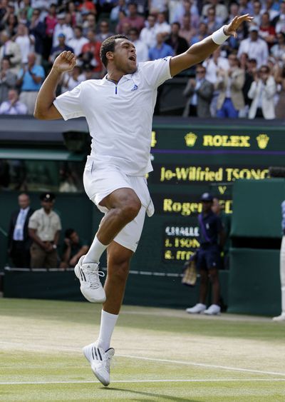Jo-Wilfried Tsonga leaps after completing his quarterfinal win over Roger Federer. (Associated Press)