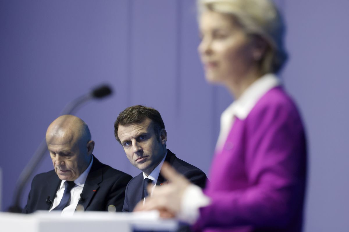 French President Emmanuel Macron, center, listens to European Commission President Ursula von der Leyen delivering her speech during the One Ocean Summit, in Brest, Brittany, Friday Feb. 11, 2022. World leaders are trying to save the planet