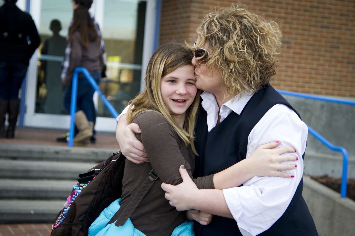 “It’s scary stuff,” said Terra Garrett as she greeted her niece Maizy Garrett in front of North Pines Middle School on Wednesday shortly after the school went into lockdown because a man with a gun had been reported nearby. School officials said they were alerted just before dismissal and did not allow students to leave alone. (Colin Mulvany)