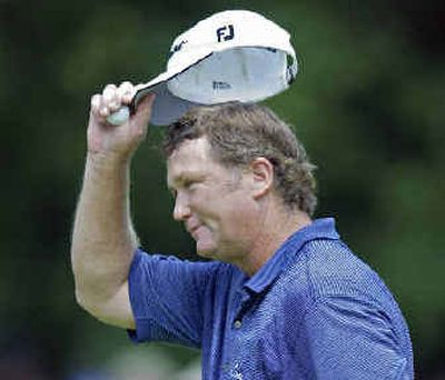 
Peter Jacobsen tips hat after finishing his round. The field faces 36 holes today. 
 (Associated Press / The Spokesman-Review)