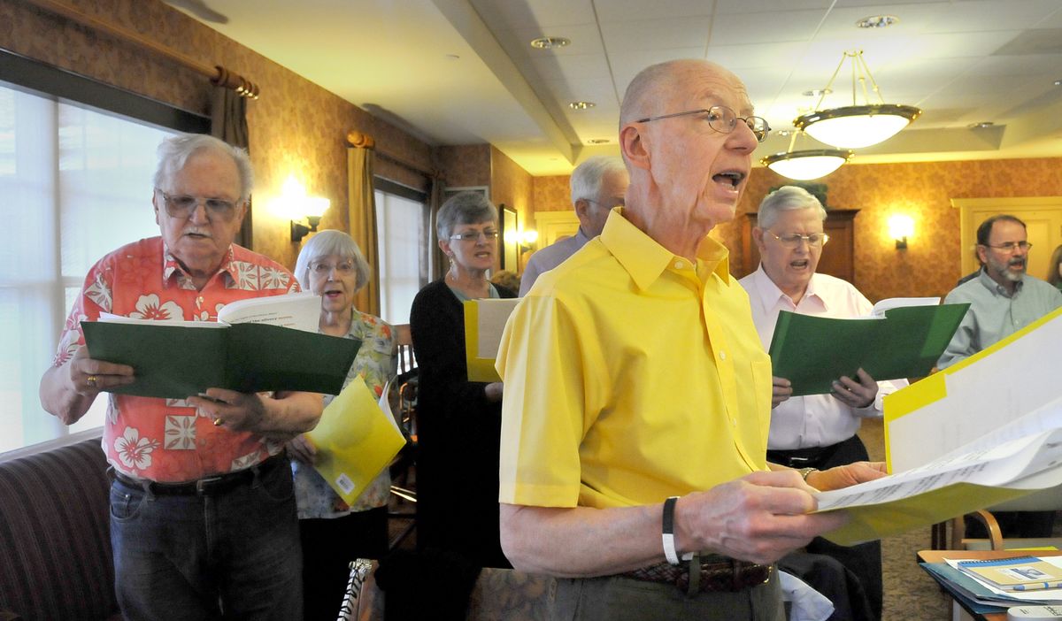 Walter Jakubowski, foreground, sings with the Tremble Clefs last month. The group uses singing as therapy for Parkinson’s Disease. They do breathing and singing exercises before perfoming. (Jesse Tinsley)