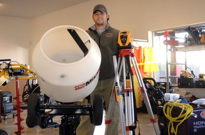 Brett Haiar, one of the partners in Lake City Rentals at 19208 E. Broadway Ave., shows off some of their equipment to rent. (J. BART RAYNIAK / The Spokesman-Review)