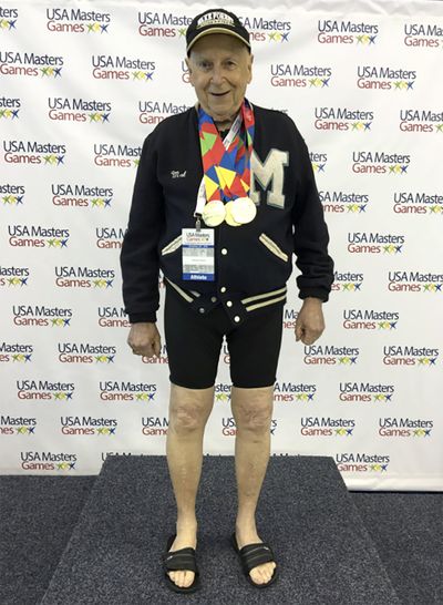 In this 2016 photo provided by Beverly Amick, her father Mal Osborn, 92, of Winston-Salem, N.C., wears a treasured 1952 letter jacket from the University of Maine, which he earned as a track athlete, while posing at a Master’s swim tournament where he won multiple gold medals. He lost the jacket in October, and with the help of a post online, it was found and returned to him.  (Beverly Amick)