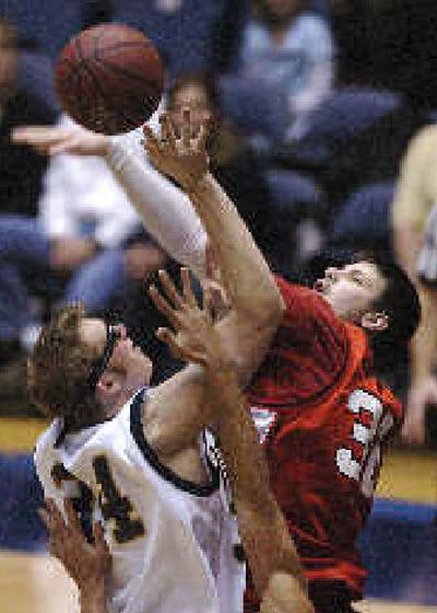 
Eastern's Jake Beitinger, right, deflects Ted Morris' first-half shot. 
 (Associated Press / The Spokesman-Review)
