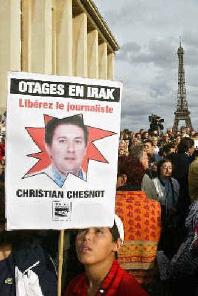 
A protester holds a sign reading 