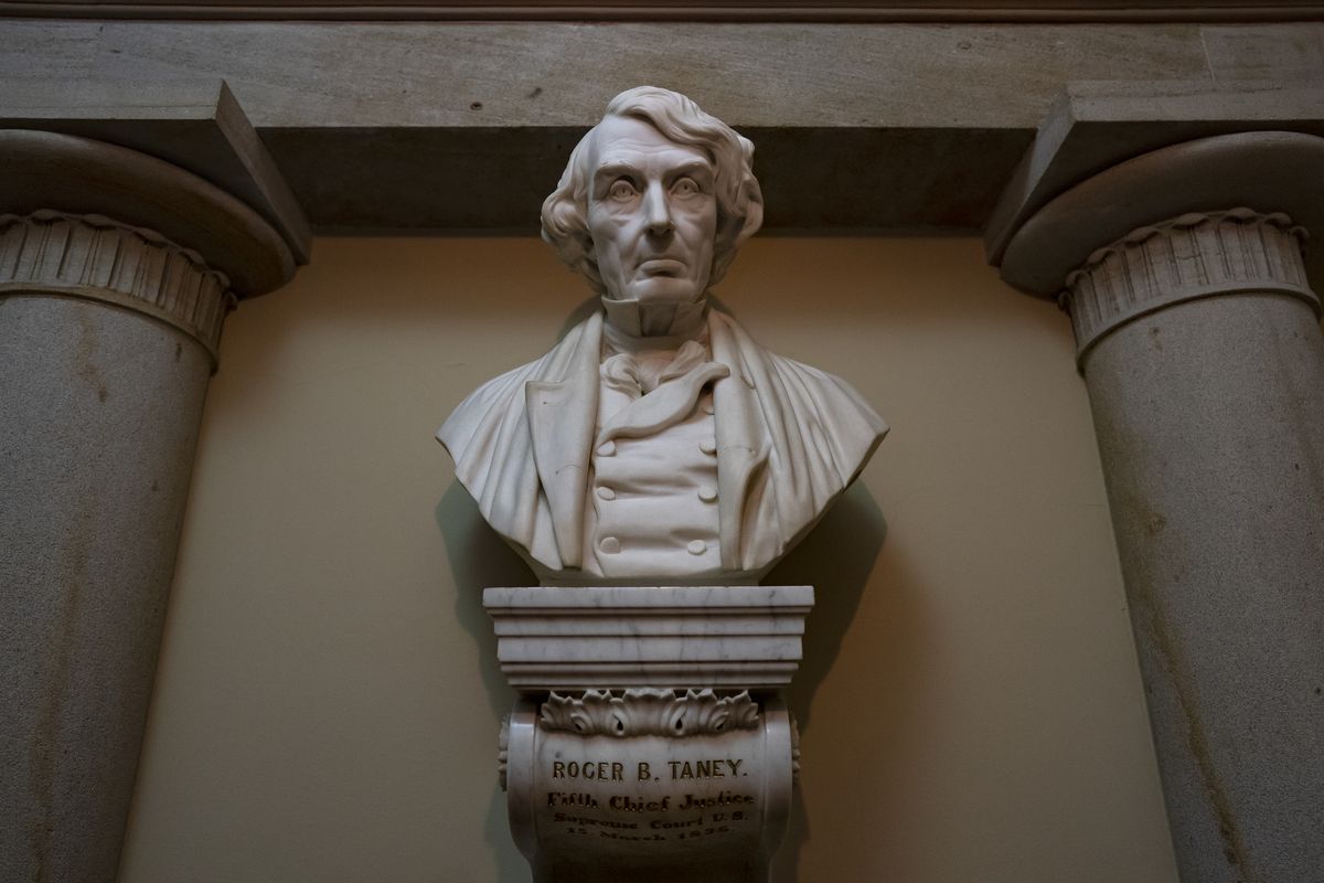 FILE - In this March 9, 2020, file photo a marble bust of Chief Justice Roger Taney is displayed in the Old Supreme Court Chamber in the U.S. Capitol in Washington. Taney, who came from a wealthy, slave-owning family in Calvert County, Md., led the Supreme Court in the 1857 ruling against Dred Scott, an enslaved African American man, who had sued for his freedom. The House is expected to approve a bill Tuesday that would remove from the bust of Taney from the Capitol, as well as statues of Jefferson Davis and others who served in the Confederacy. (J. Scott Applewhite)