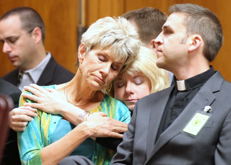 Jeanne Tiller, widow of slain abortion doctor George Tiller, hugs a family member during the sentencing of Scott Roeder in Sedgwick County District Court in Wichita, Kan., Thursday, April 1, 2010. Roeder was convicted last January of murdering Tiller's husband, Dr. George Tiller. (Jeff Tuttle / The Wichita Eagle, Pool)
