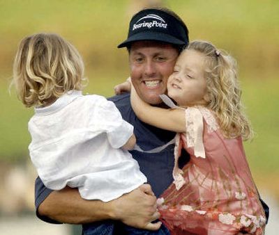 Phil Mickelson is greeted by his children Evan, left, and Sophia after winning the BellSouth Classic.
(Associated Press / The Spokesman-Review)
