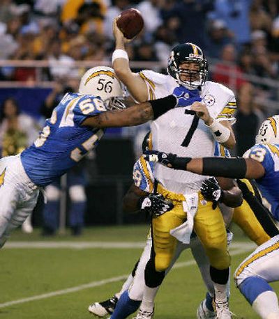 
Ben Roethlisberger tries to get a pass off under pressure from Chargers Shawne Merriman. 
 (Associated Press / The Spokesman-Review)