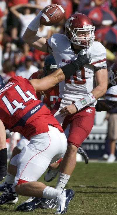 WSU starting quarterback Jeff Tuel worked out in offseason to get bigger and stronger. (Associated Press)