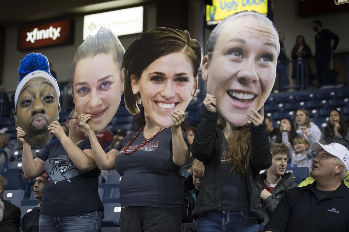 Gonzaga fans hold up posters of Zags