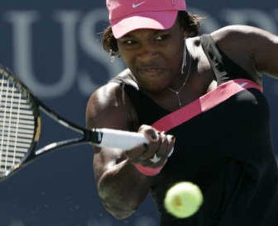 
Serena Williams of the United States returns a volley to Marion Bartoli of France on Sunday. Associated Press
 (Associated Press / The Spokesman-Review)