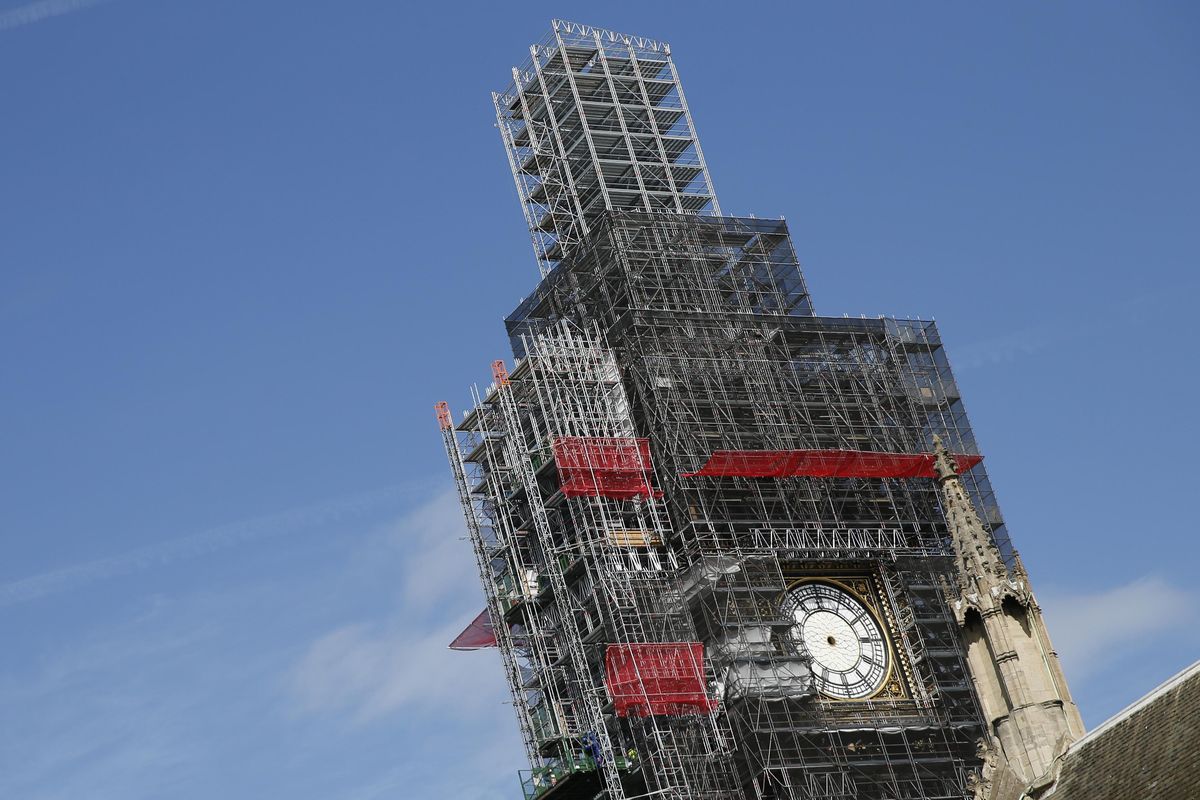 In this Tuesday, April 17, 2018  photo, scaffolding surrounds the Queen Elizabeth Tower, which holds the bell known as Big Ben, in London. The bell of Britain’s Parliament has been largely silent since 2017 while its iconic clock tower undergoes four years of repairs. Brexit-backing lawmakers are campaigning for it to strike at the moment Britain leaves the European Union -- 11 p.m. (2300GMT) on Jan. 31. Parliamentary officials say it is not worth the cost, which could come to 500,000 pounds ($650,000). The House of Commons Commission said Tuesday, Jan. 14, 2020 that because the clock mechanism has been dismantled and the belfry is currently getting a new floor, arranging for the bell to ring “could result in huge costs to the public purse.” (Alastair Grant / AP)