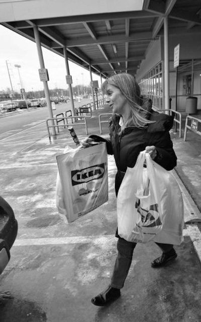 
Marta Galante carries her purchases to her car outside an Ikea store in Conshohocken, Pa., earlier this month. The Swedish retailer, which has its U.S. headquarters in suburban Conshohocken, announced Tuesday that it will start charging customers a nickel for every plastic bag they use. 
 (Associated Press / The Spokesman-Review)